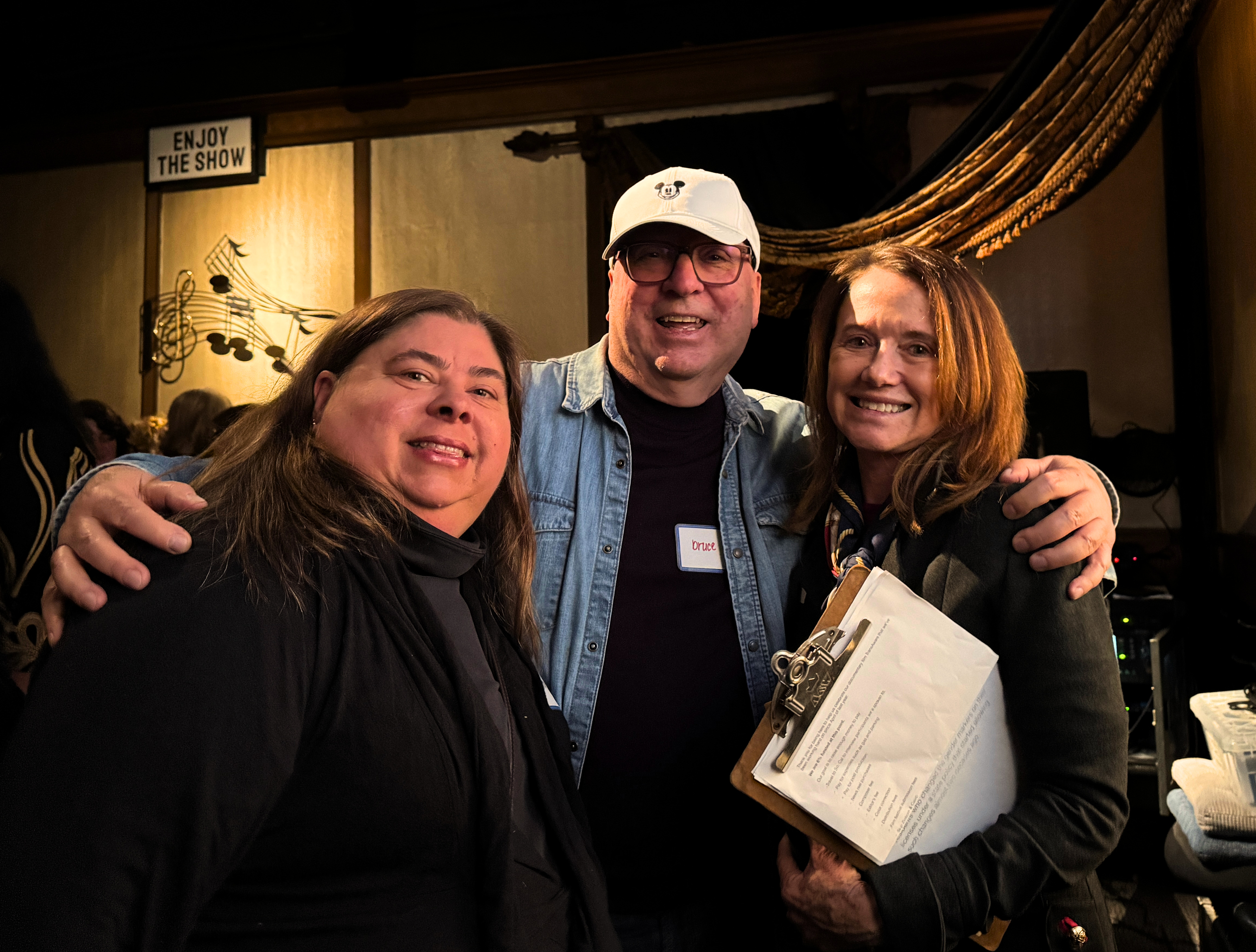 Three members of Phase 4 Films at a fundraiser for TransAware